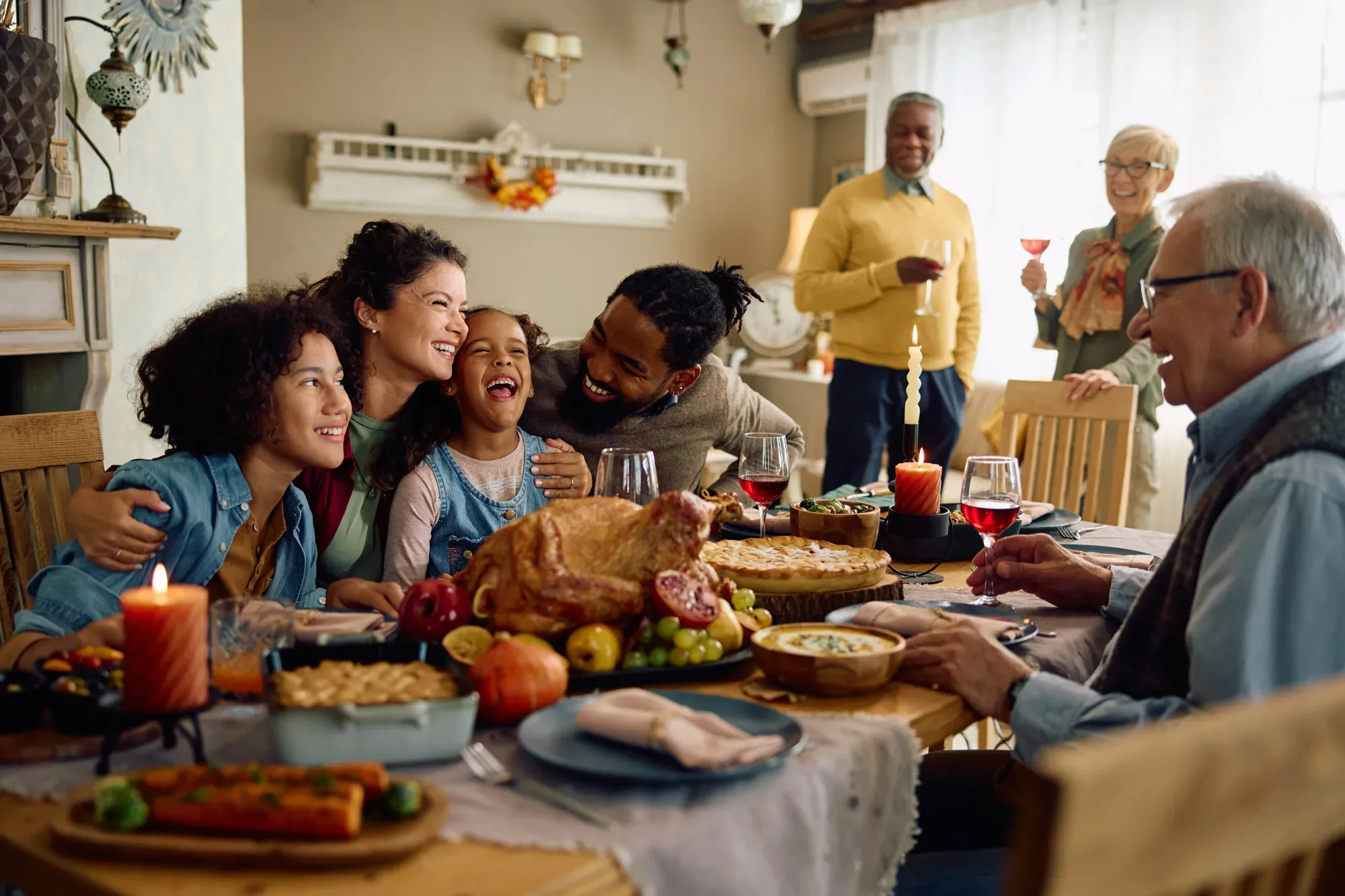 A multi-generational family sharing a meal together